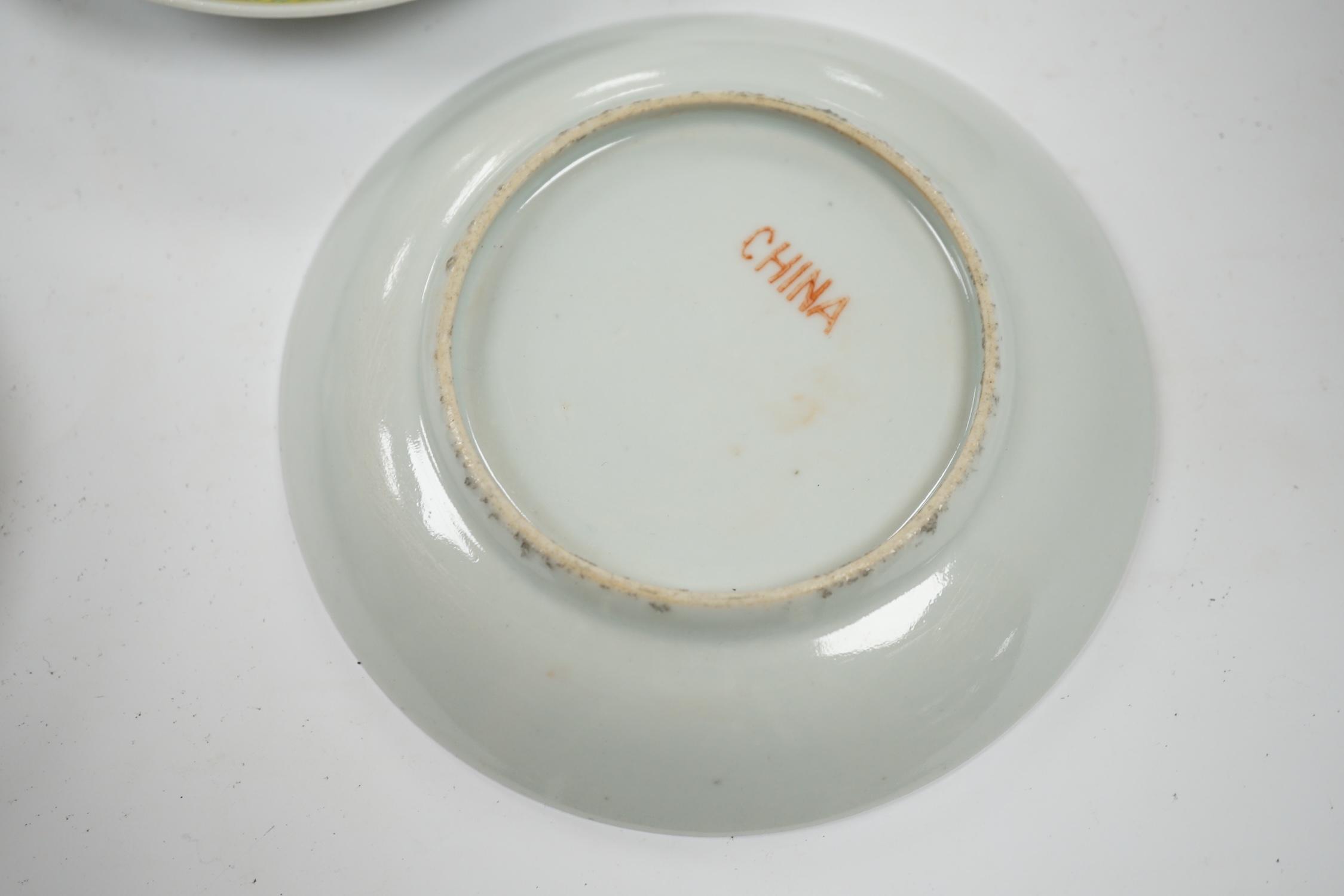 Four Chinese yellow ground saucer dishes, Republic period, 13.5cm diameter. Condition - good